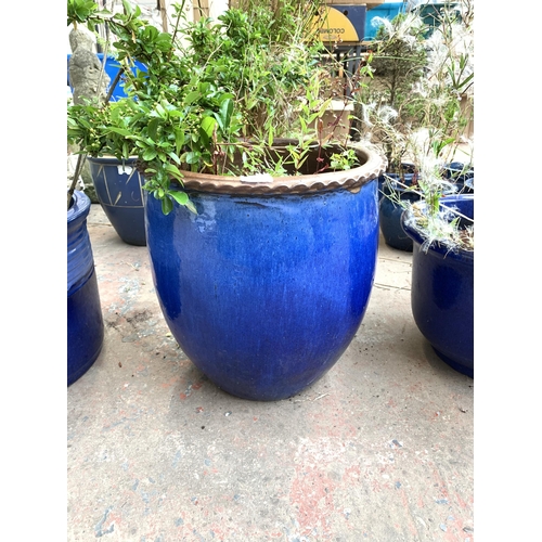 1072 - Two blue glazed garden planters - largest approx. 40cm high x 36cm diameter