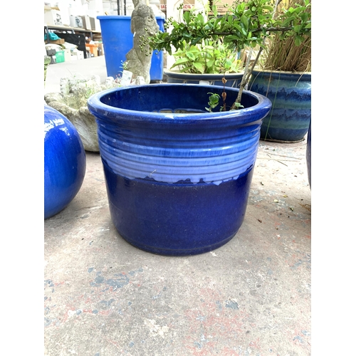 1072 - Two blue glazed garden planters - largest approx. 40cm high x 36cm diameter