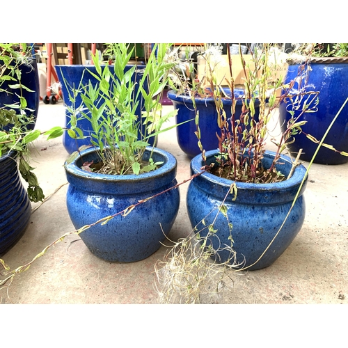 1079 - Four blue glazed garden planters - largest approx. 18cm high x 27cm diameter