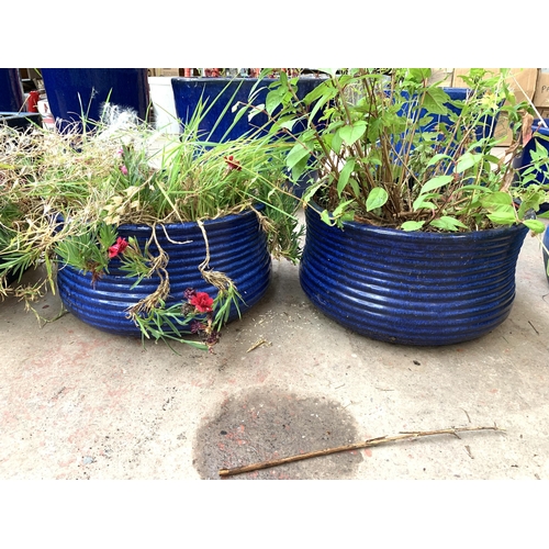 1080 - Three blue glazed garden planters - largest approx. 20cm high x 37cm diameter