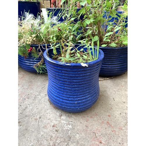 1080 - Three blue glazed garden planters - largest approx. 20cm high x 37cm diameter