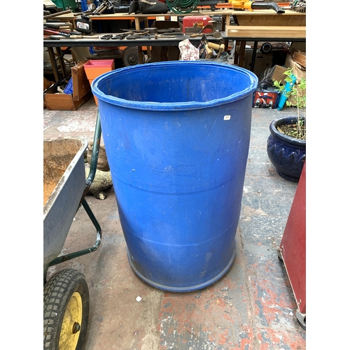 1087 - Three items, one heavy duty wheelbarrow, one plastic compost bin and one 250 gallon drum