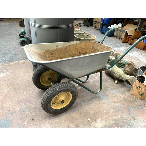 1087 - Three items, one heavy duty wheelbarrow, one plastic compost bin and one 250 gallon drum