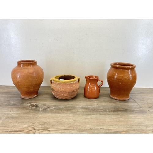 390 - Four glazed terracotta items, three vases and one jug - largest approx. 22cm high