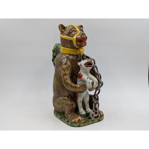 353 - A Majolica style 'Bears Grease' bear baiting advertising jug - approx. 30cm high