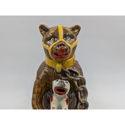 353 - A Majolica style 'Bears Grease' bear baiting advertising jug - approx. 30cm high