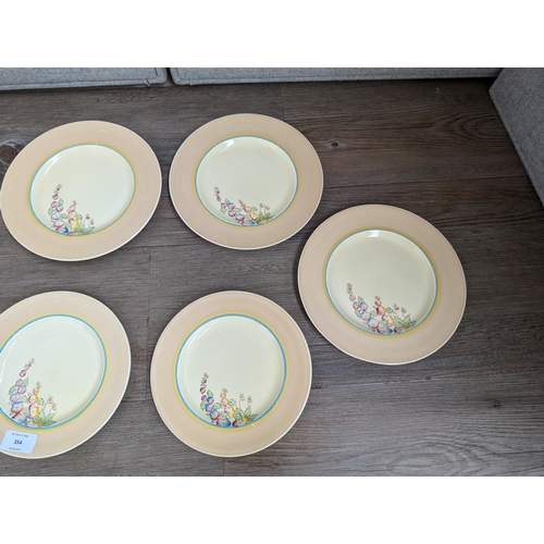 354 - Ten Clarice Cliff for Newport Pottery Co. England Hollyhocks pattern plates, six 23cm and four 20cm