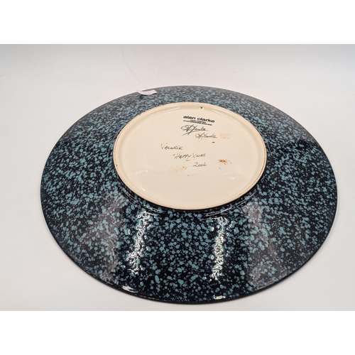 369 - An Alan Clarke Timeslip pattern wall charger signed to reverse - approx. 40cm diameter