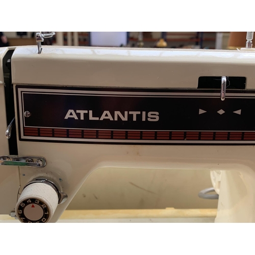 756 - A cased Atlantis model 302 electric sewing machine with boxed accessories and foot pedal