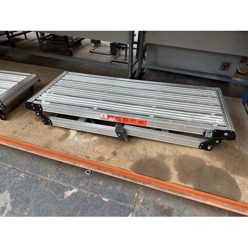 1035 - Two foldable aluminium work steps