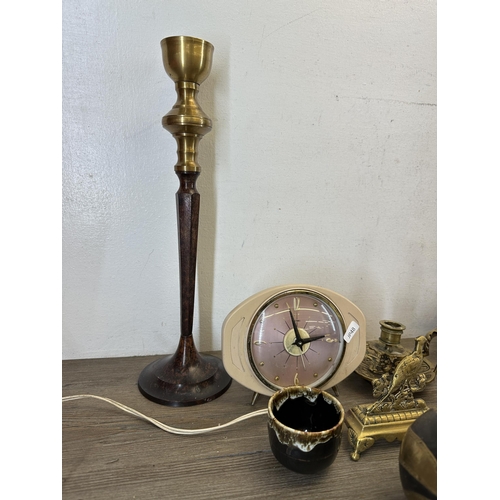 540 - A collection of items to include brass and cast metal candlestick - approx. 39cm high, brown glazed ... 