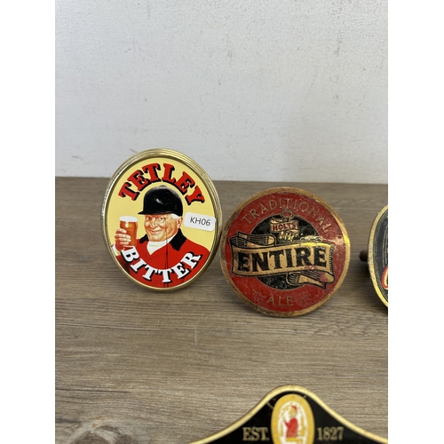 544 - Eight vintage beer pump clip badges to include Tetley Bitter, Burton Ale, Theakston Best Bitter, Hol... 