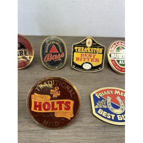 544 - Eight vintage beer pump clip badges to include Tetley Bitter, Burton Ale, Theakston Best Bitter, Hol... 