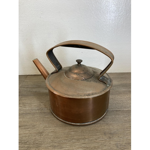 426 - A collection of 19th century and later metalware to include copper kettle, cast iron and brass fire ... 