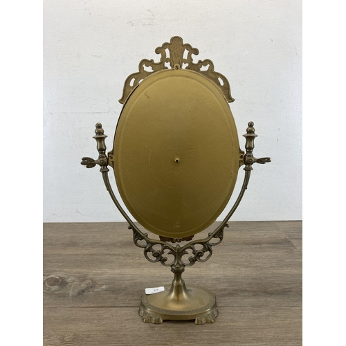 428 - A Rococo style brass bathroom mirror - approx. 49cm high