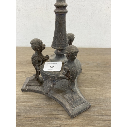 429 - A 19th century cast metal four branch candelabra - approx. 56cm high