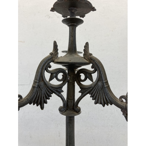 429 - A 19th century cast metal four branch candelabra - approx. 56cm high