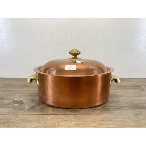 430 - A 19th century copper and brass oval lidded cooking pot with two handles - approx. 12.5cm high x 38c... 