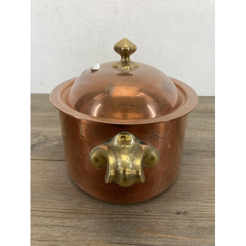 430 - A 19th century copper and brass oval lidded cooking pot with two handles - approx. 12.5cm high x 38c... 