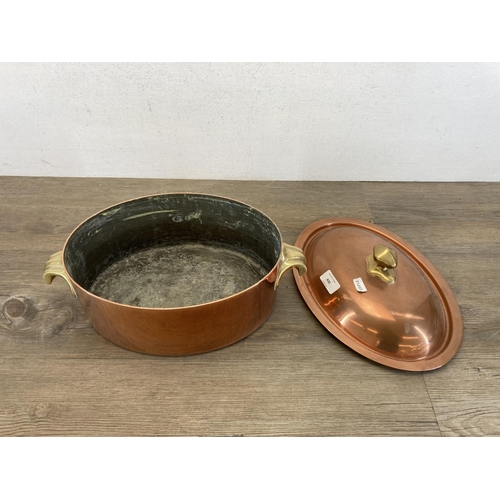 430 - A 19th century copper and brass oval lidded cooking pot with two handles - approx. 12.5cm high x 38c... 