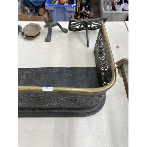 433 - A collection of 19th century and later metalware to include two brass and cast metal fire fenders, 1... 