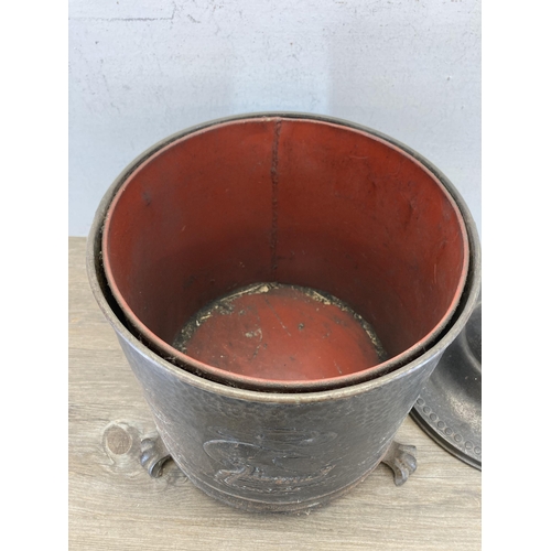 434 - A vintage cast metal coal bucket with lion head handles, lion paw feet and brass spherical top - app... 