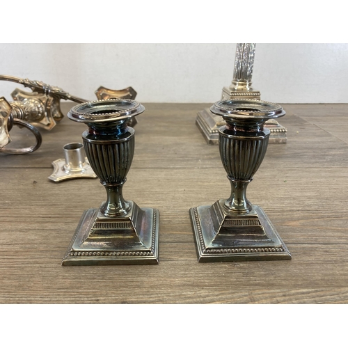 439 - Four pieces of antique metalware, one 19th century silver plated Corinthian candleholder - approx. 3... 