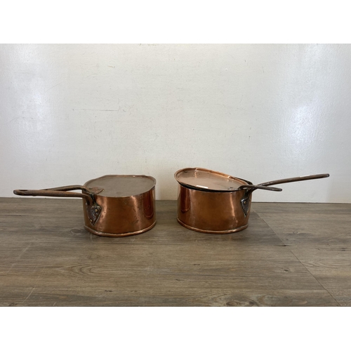 447 - Two 19th century copper and cast metal lidded saucepans