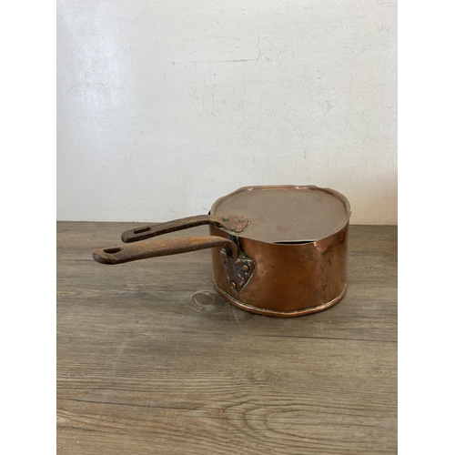 447 - Two 19th century copper and cast metal lidded saucepans