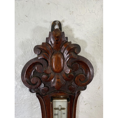 170 - A 19th century Eustance & Co. of Warrington carved oak cased aneroid barometer - approx. 90cm high