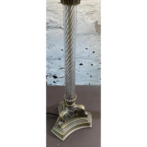 22 - A pair of 19th century style gilt metal table lamps on tripod supports - approx. 52cm high