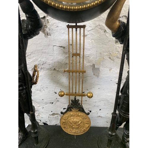 236 - A French Japy Freres gilded spelter figural two train clock with glass dome, pendulum and key on ebo... 