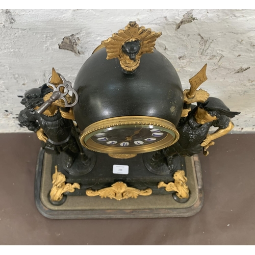 236 - A French Japy Freres gilded spelter figural two train clock with glass dome, pendulum and key on ebo... 