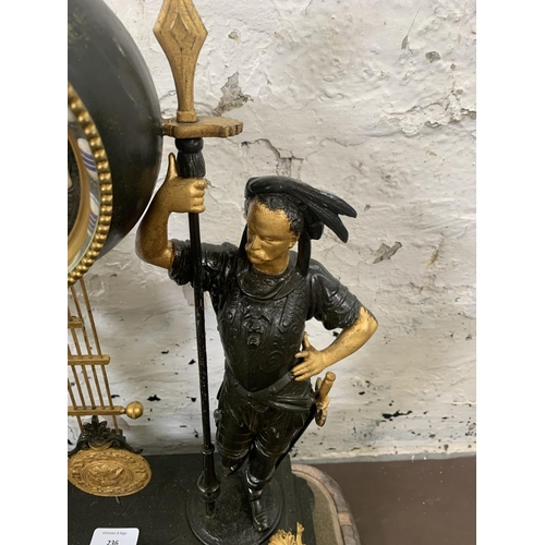 236 - A French Japy Freres gilded spelter figural two train clock with glass dome, pendulum and key on ebo... 