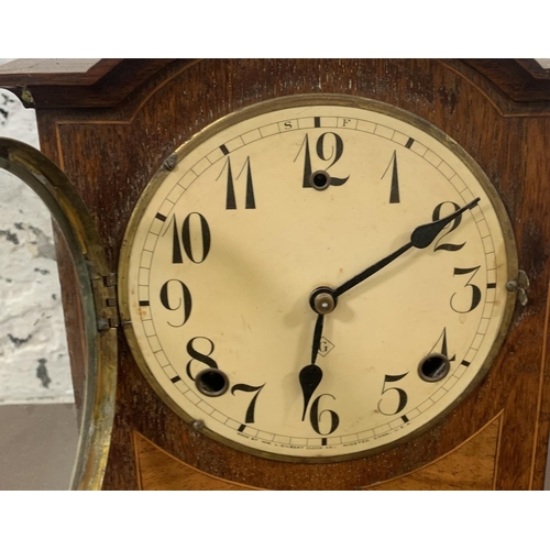 237 - A late 19th/early 20th century WM L. Gilbert Clock Co. USA inlaid oak cased chiming mantel clock wit... 