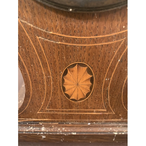 241 - An Edwardian inlaid oak cased balloon shaped chiming mantel clock - approx. 35cm high x 20cm wide x ... 