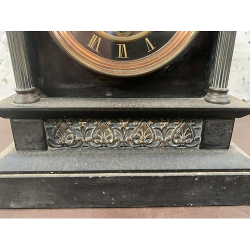 242 - A Kemp & Wilcox of Paris black slate and copper mantel clock with pendulum - approx. 27cm high x 20c... 