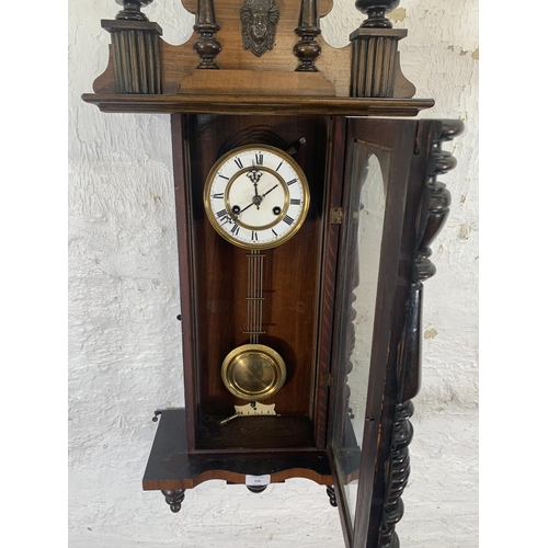 258 - A 19th century German walnut cased regulator wall clock with imperial eagle mount, key and pendulum ... 