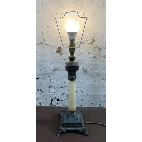 29 - A French Empire style cast metal and marble effect table lamp - approx. 48cm high