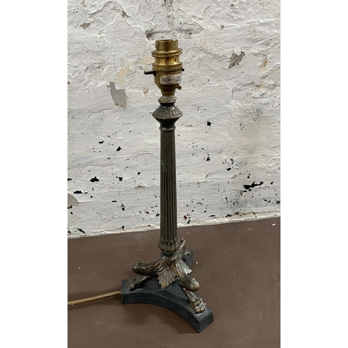 31 - A French Empire style bronzed tri-footed table lamp - approx. 36cm high