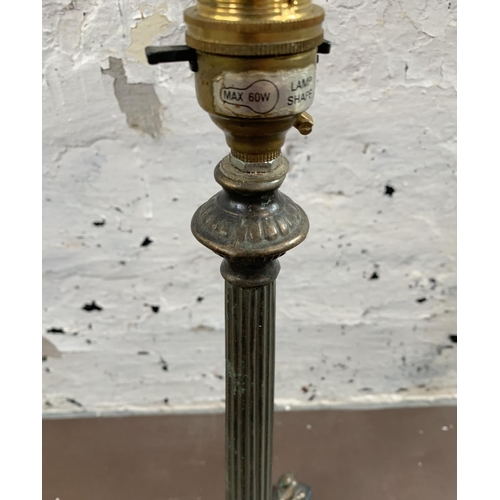 31 - A French Empire style bronzed tri-footed table lamp - approx. 36cm high