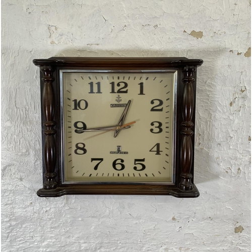 54 - A mid 20th century Cartex plastic cased quartz wall clock - approx. 33cm high x 38cm wide