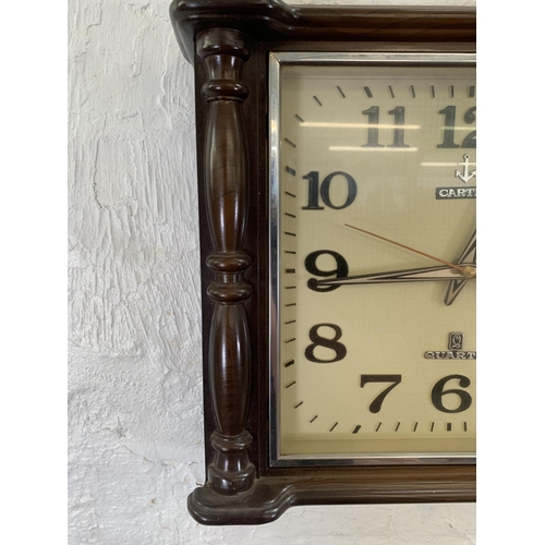 54 - A mid 20th century Cartex plastic cased quartz wall clock - approx. 33cm high x 38cm wide