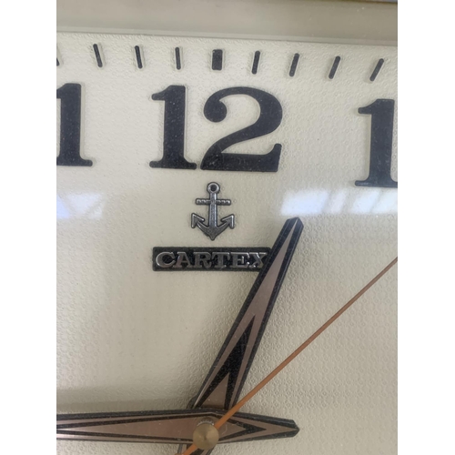 54 - A mid 20th century Cartex plastic cased quartz wall clock - approx. 33cm high x 38cm wide