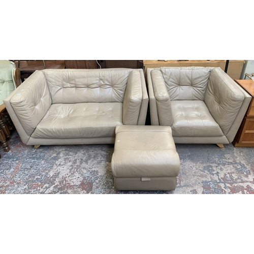 66 - A modern beige leather three piece lounge suite comprising two seater sofa, armchair and footstool