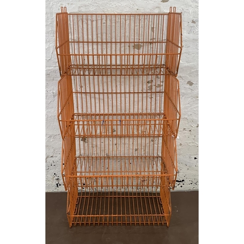 72 - Four mid 20th century orange wired metal shop display baskets - approx. 33cm high x 59cm wide x 49cm... 