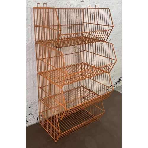 72 - Four mid 20th century orange wired metal shop display baskets - approx. 33cm high x 59cm wide x 49cm... 