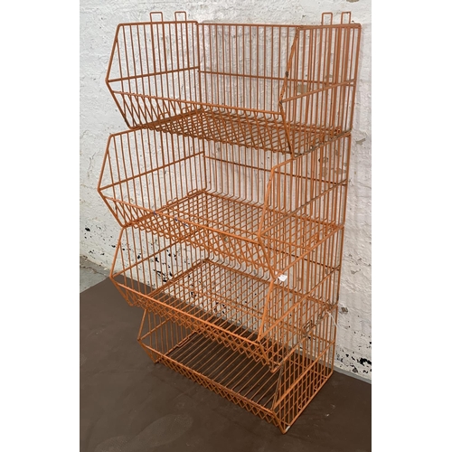 72 - Four mid 20th century orange wired metal shop display baskets - approx. 33cm high x 59cm wide x 49cm... 