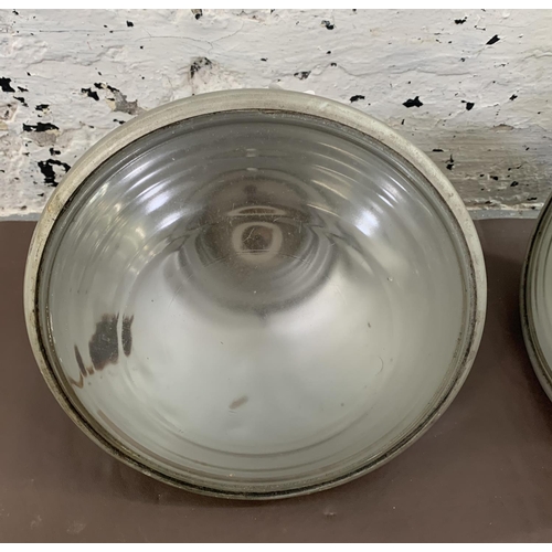 77 - A pair of mid 20th century Real Pat No. 568702 aluminium industrial ceiling lights - approx. 25cm di... 