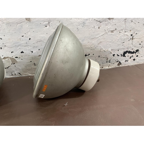 77 - A pair of mid 20th century Real Pat No. 568702 aluminium industrial ceiling lights - approx. 25cm di... 